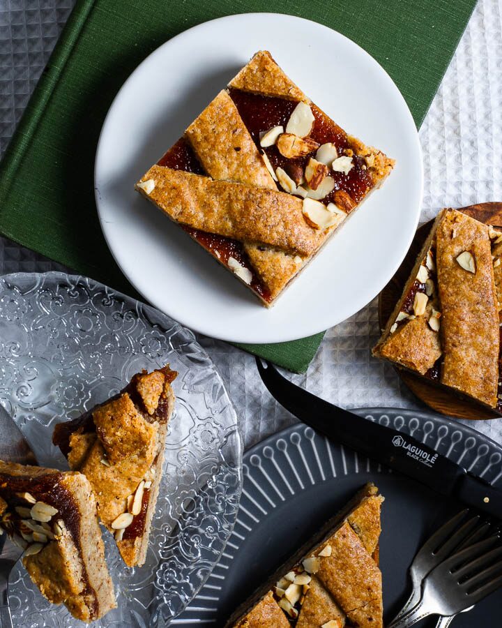 Apricot almond bars topped with sliced almonds