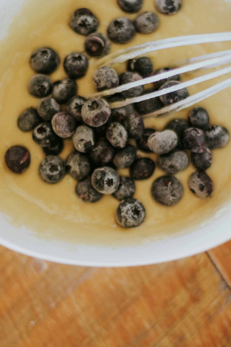 Whisking frozen blueberries into batter