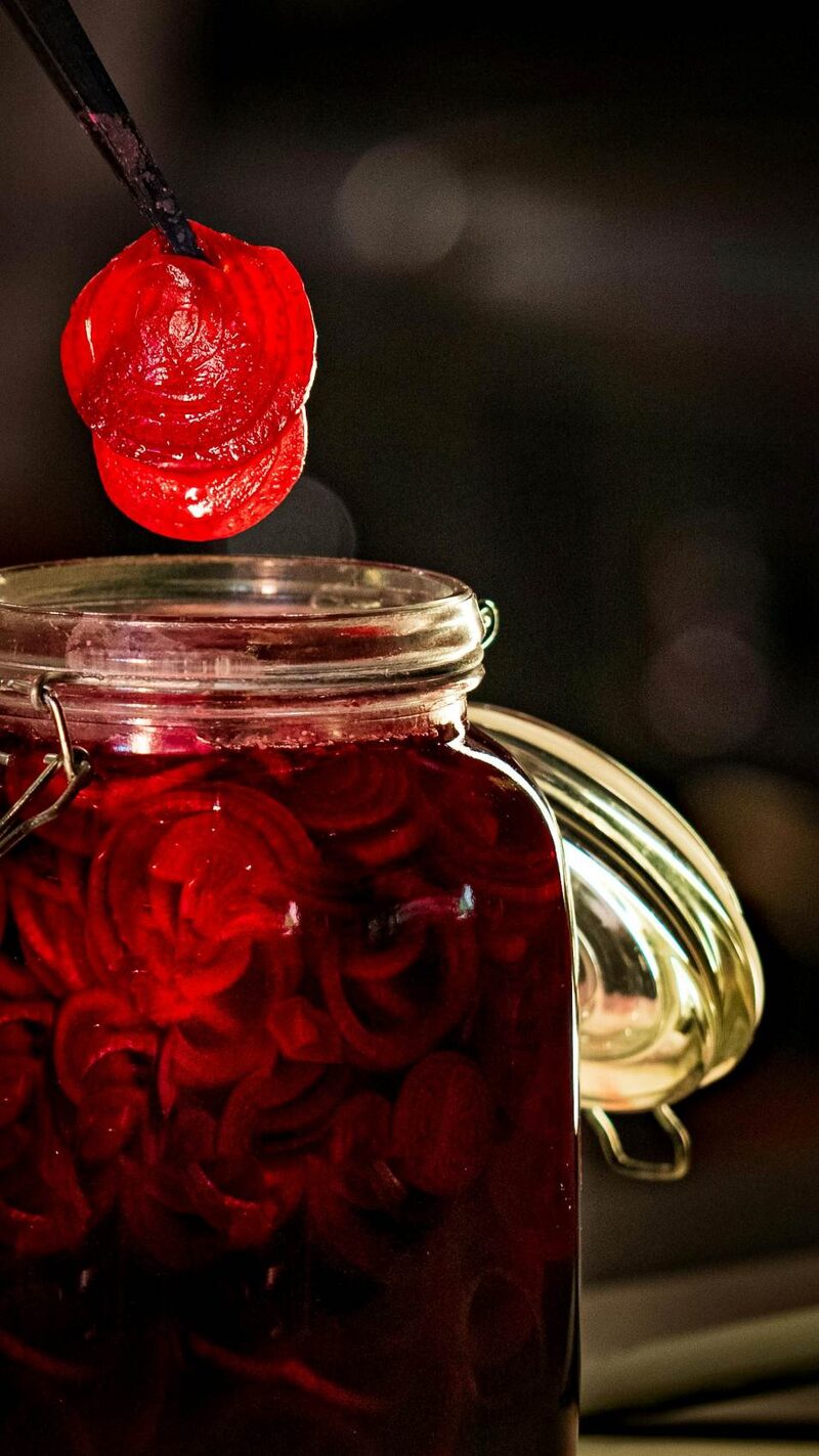 Sliced fermented beets in a glass jar