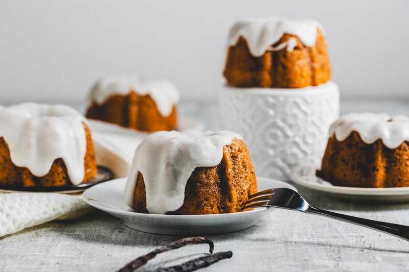Well-risen glazed mini bundt cakes with clean, domed tops