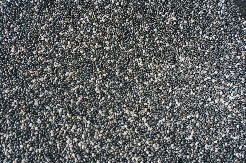 A close-up of black and white chia seeds