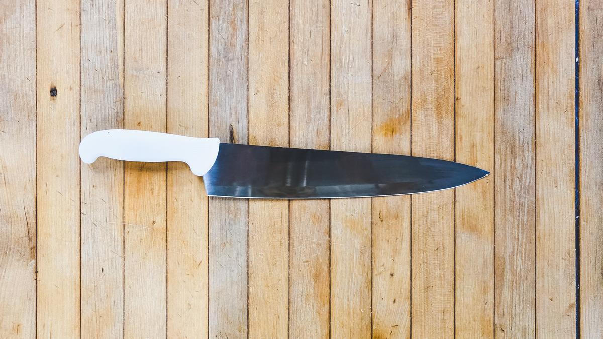 A Dexter knife on a wooden board