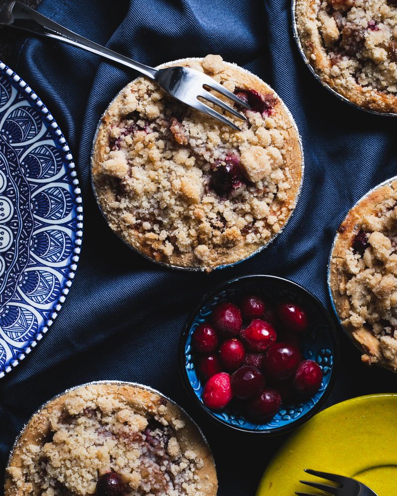 Mini gluten-free vegan crumble pies with fresh cranberries, from the Sensible Edibles bakery
