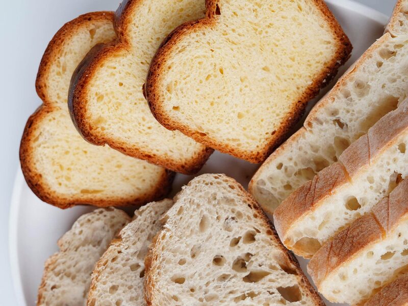 Slices of various types of bread arranged on a plate