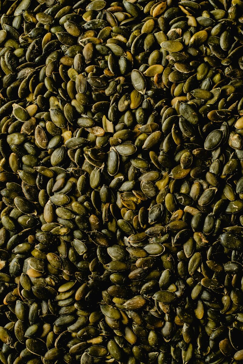 A full frame of raw green pumpkin seeds